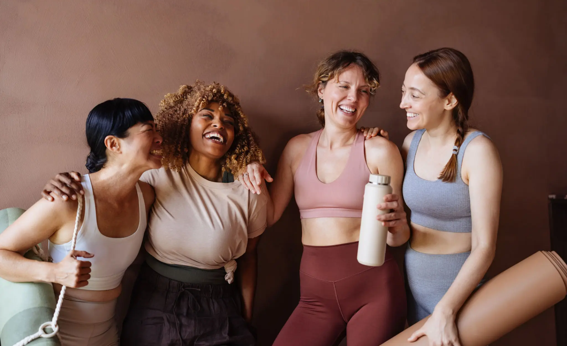 Friends enjoying post-workout laughter