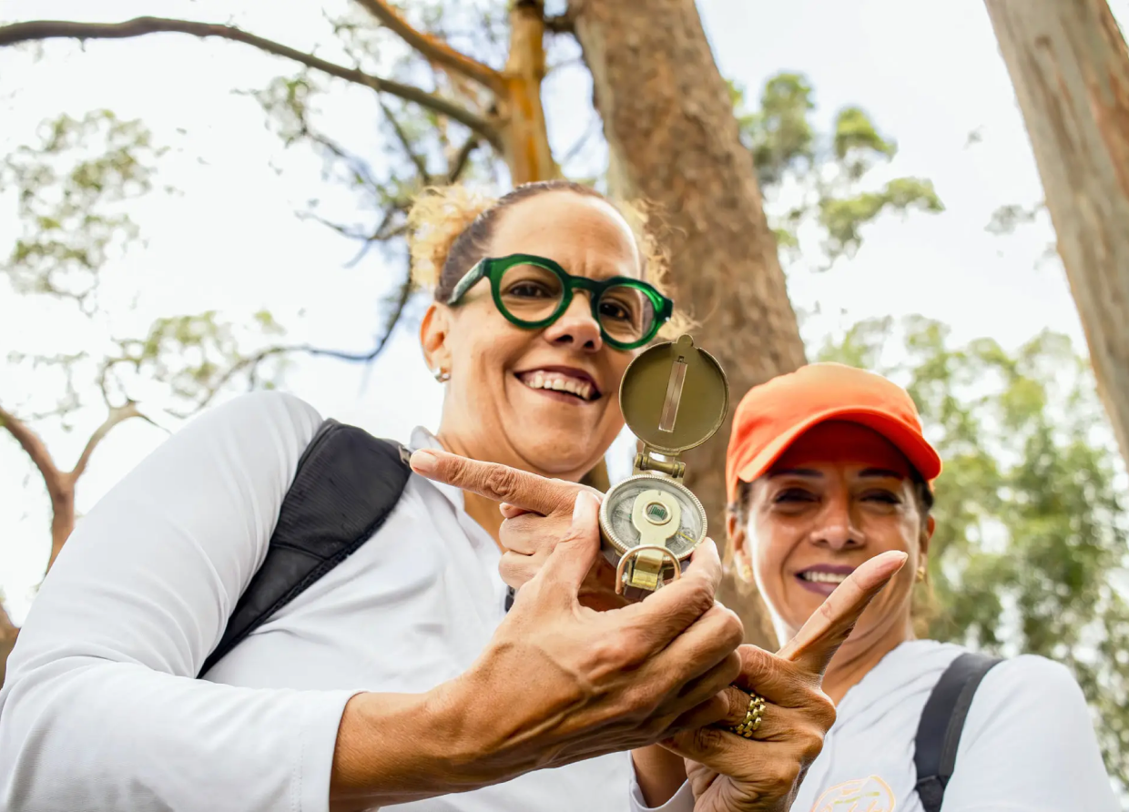 Women using a compass outdoors